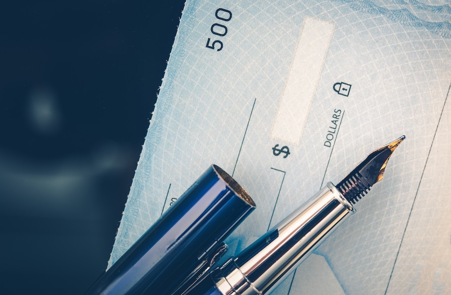An invoice and an unpaid payment on a desk