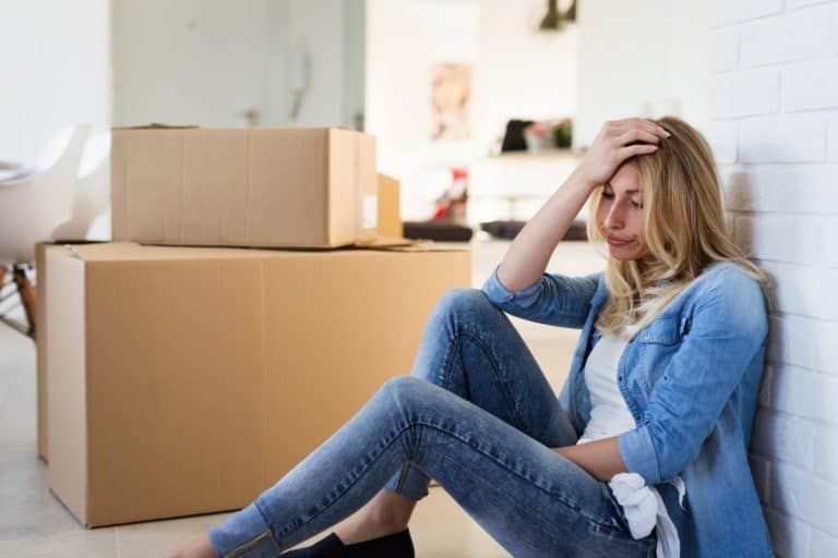 Tired woman exhausted while moving into new home