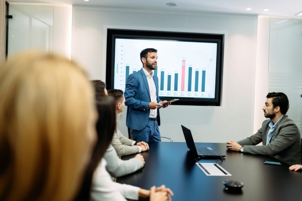 A board meeting in a conference room, illustrating company decision making