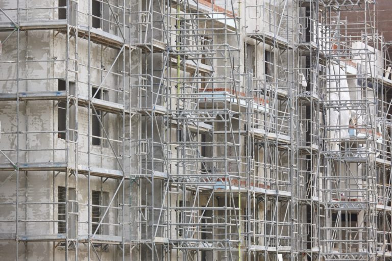 Scaffolding structure on a building. Construction architecture industry. Workplace