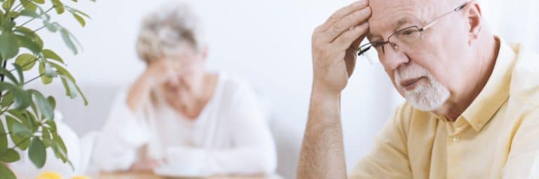 Worried elderly man and woman