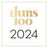 לוגו של "duns 100 2024" הכולל טקסט זהוב מסוגנן על רקע שחור מוקף בתוך מסגרת מרובעת דקה מוזהבת.